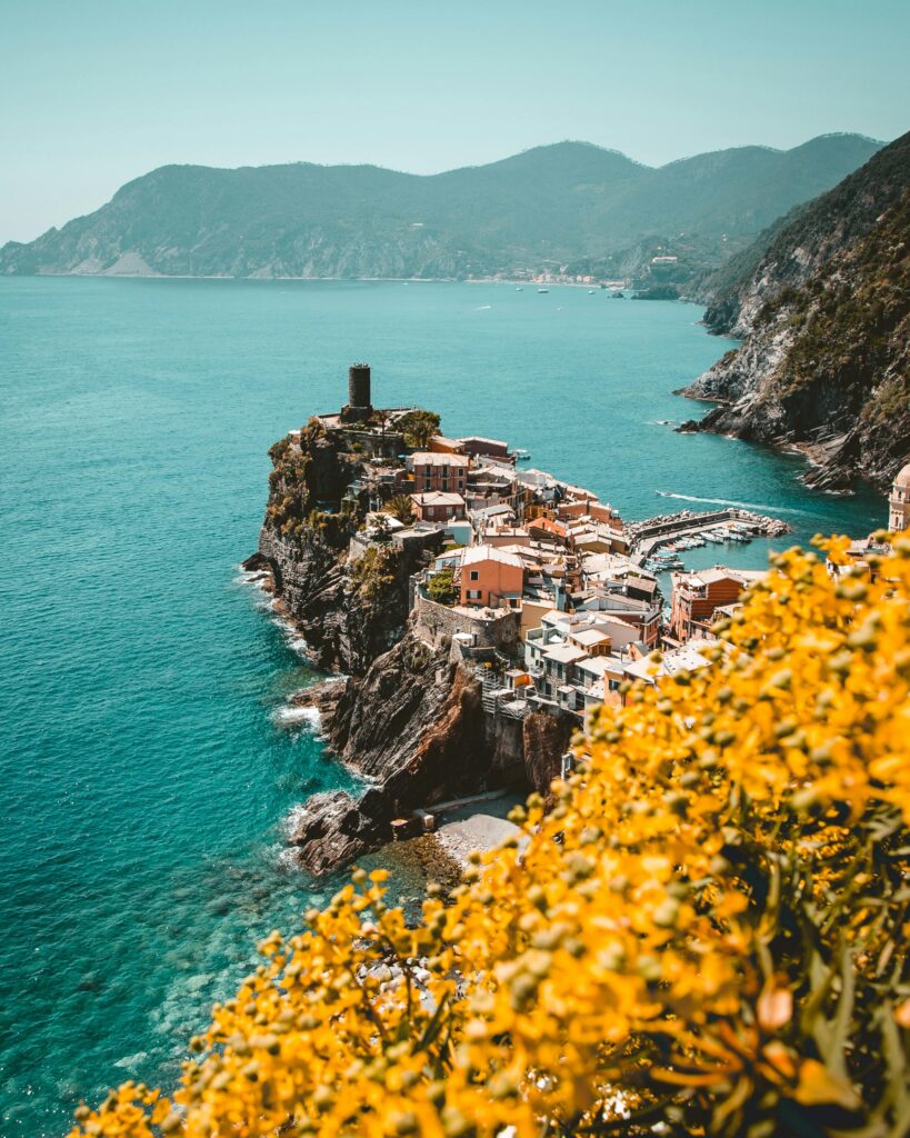 Stunning view of Vernazza with colorful houses on cliffs by the sea, Liguria, Italy.