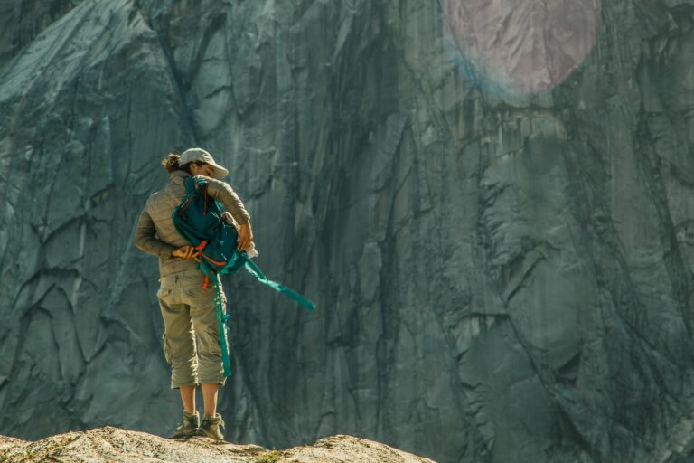 Woman climber preparing for ascent in Cochamó, Chilean countryside.