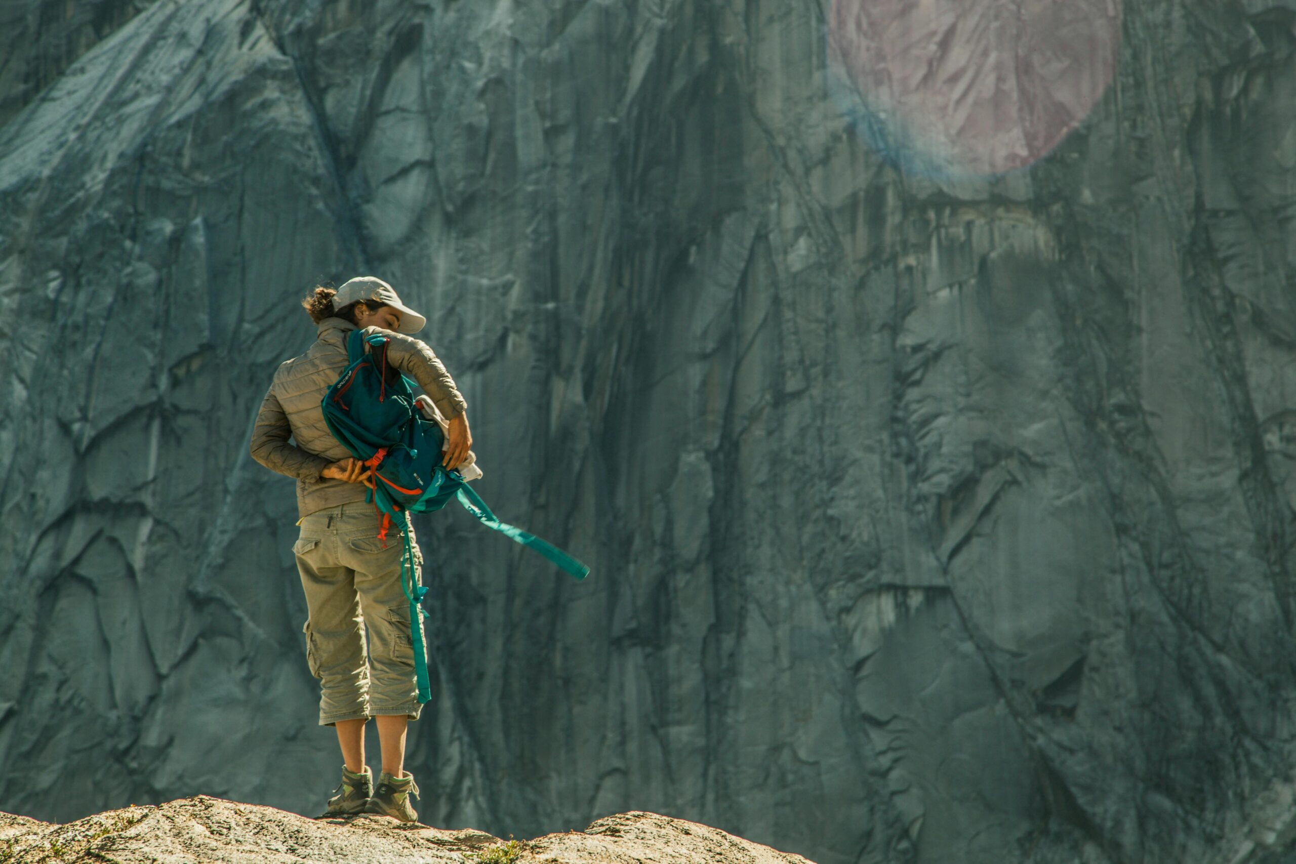 Woman climber preparing for ascent in Cochamó, Chilean countryside.