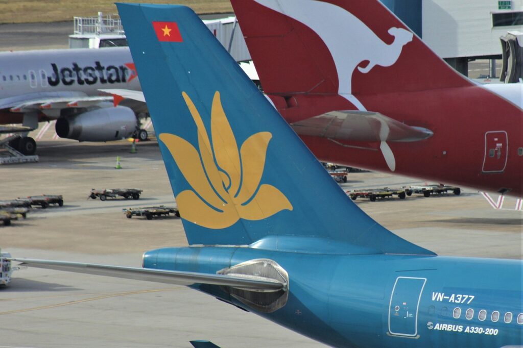 vietnam airlines, decals, blue, tail wing, traveler, transportation, plane, airplane, aeroplane, australia, sydney, airport, logo, signage, vertical stabilizer, empennage, vn-a377, syd, airbus a330, flag carrier, state-owned enterprise, connection, departure, budget airline, flight, vietnam airlines, vietnam airlines, vietnam airlines, vietnam airlines, vietnam airlines
