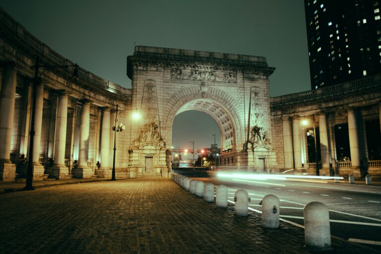 Beautiful night shot of the Manhattan Bridge arch in New York City with light streaks.