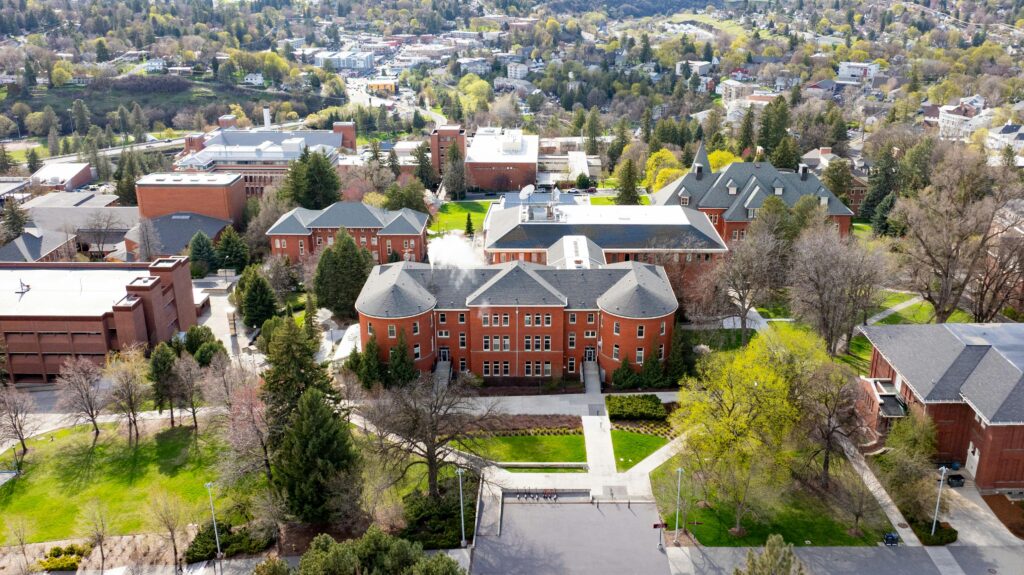 Explore an aerial perspective of Washington State University's stunning architecture and lush campus.