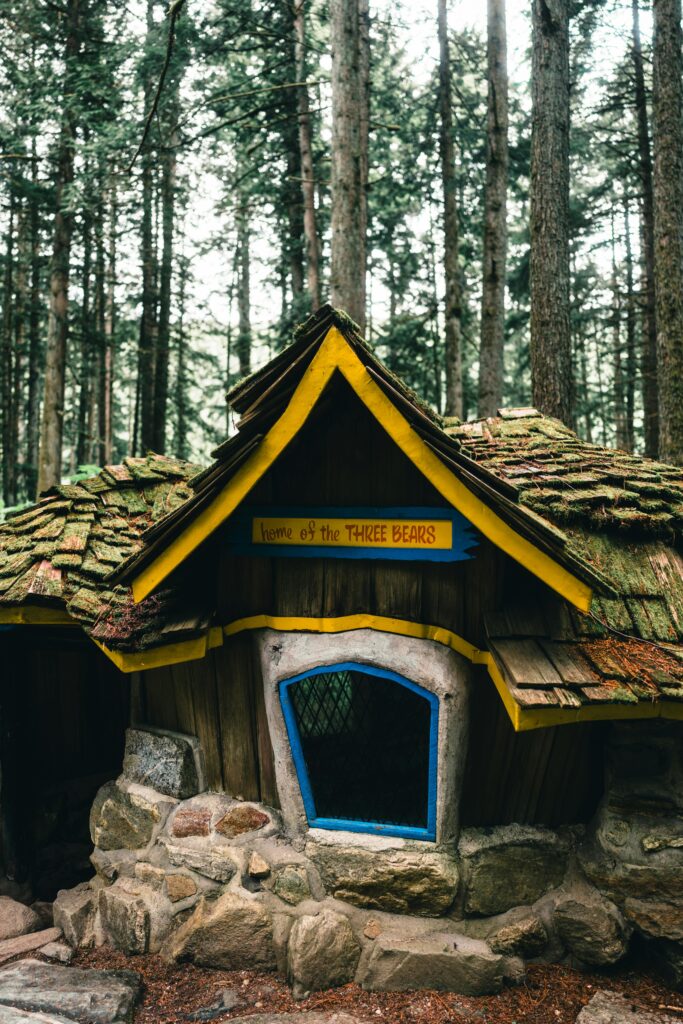 Enchanted forest cabin inscribed with 'Home of the Three Bears' in Revelstoke, BC.