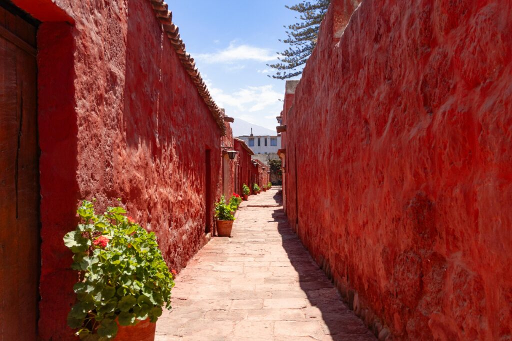 Explore the vibrant red walls of Santa Catalina Monastery in Arequipa, a testament to Peru's colonial architecture.