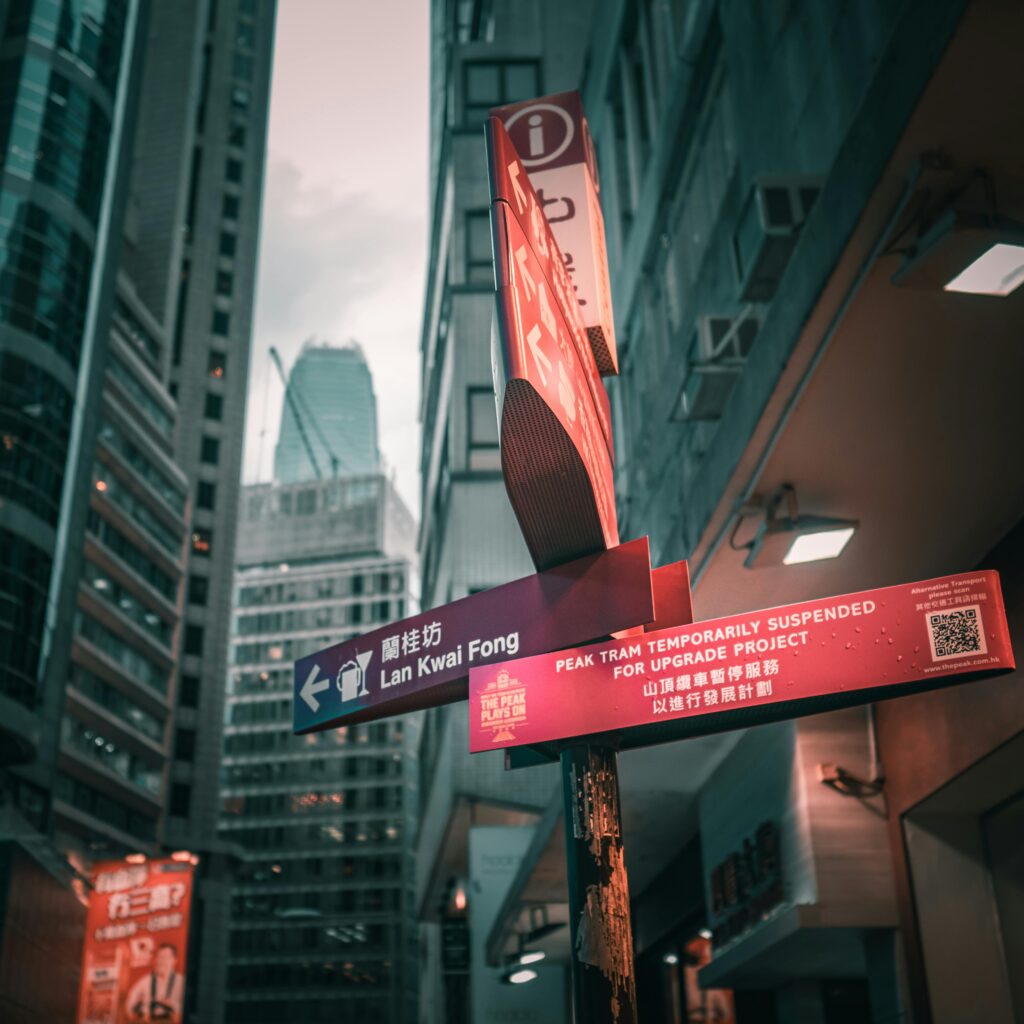 Urban scene with signs and skyscrapers at Lan Kwai Fong, Hong Kong.