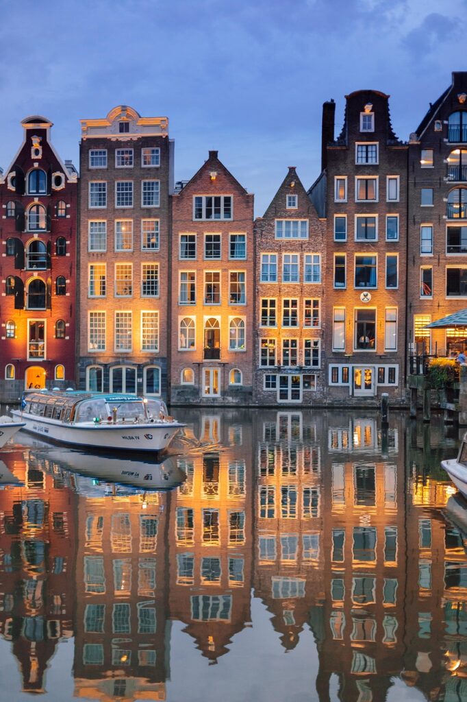 buildings, architecture, river, illuminated, reflection, mirror image, mirroring, boat, sailing, cruise, river cruise, amsterdam, nature, city, evening, night time, lights, netherlands, holland, water, sky, ship, tourism, amstelpark, amsterdam-buitenveldert, phone wallpaper, houses, aesthetic wallpaper, iphone wallpaper