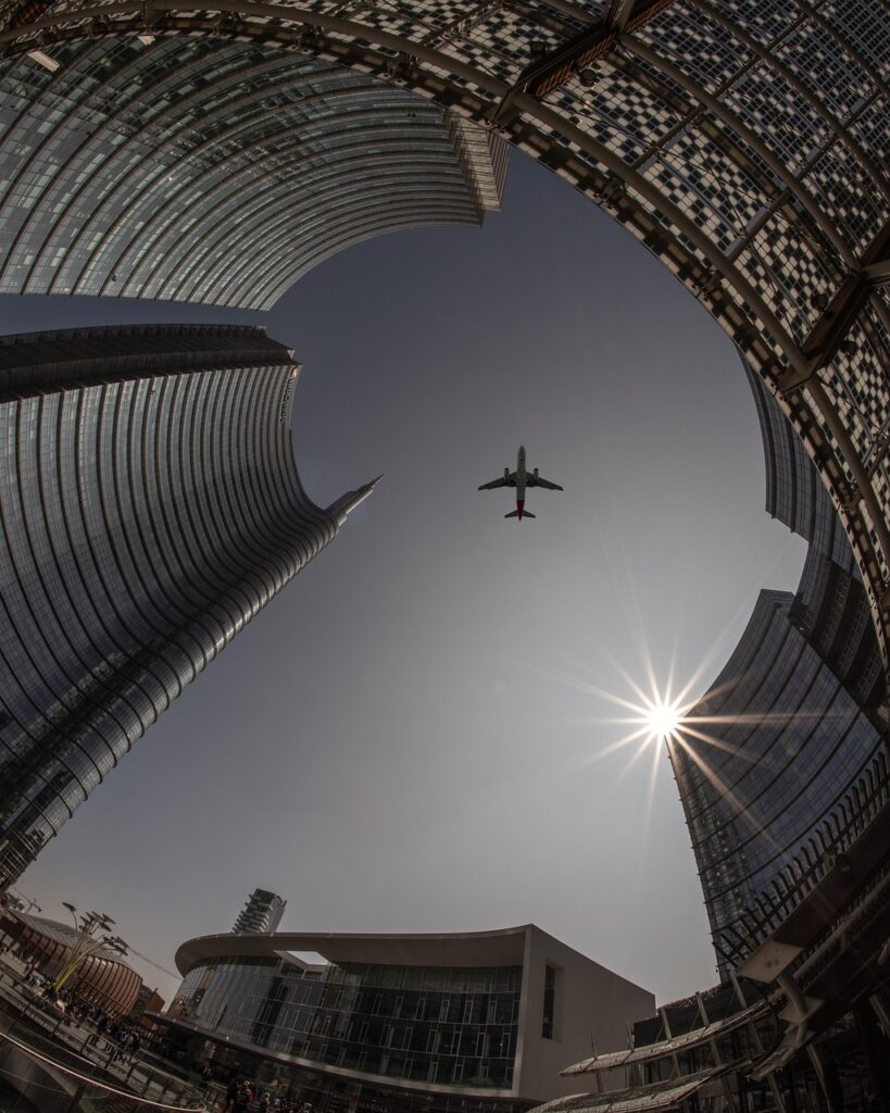 plane, city, architecture, nature, sky, airplane, flight, travel, sun, urban, buildings, tourism, outdoors, transportation, cityscape, skyline, tower, skyscrapers, lookup, aircraft