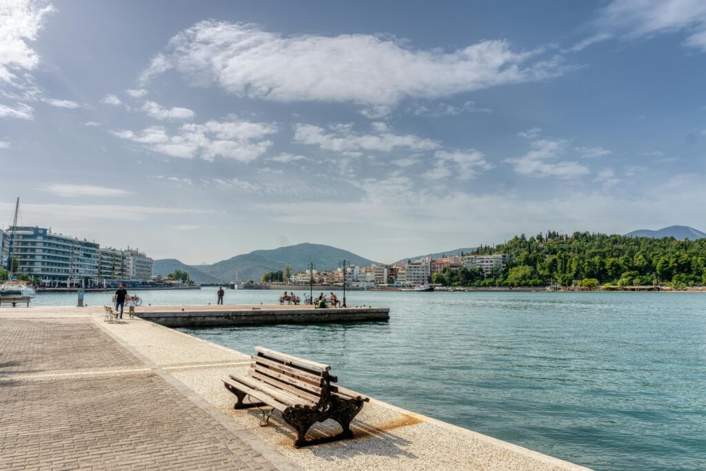 Scenic view of Chalkida's promenade with a bench and view of the sea.