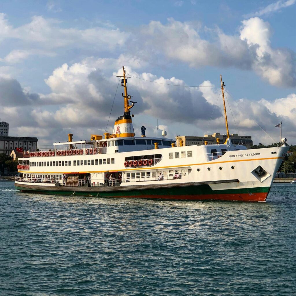 A beautiful ferry cruising on the Bosphorus in Istanbul under cloudy skies.